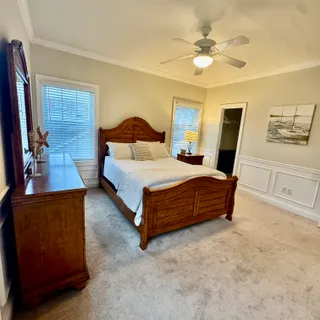 a bathroom with a toilet a sink and a mirror