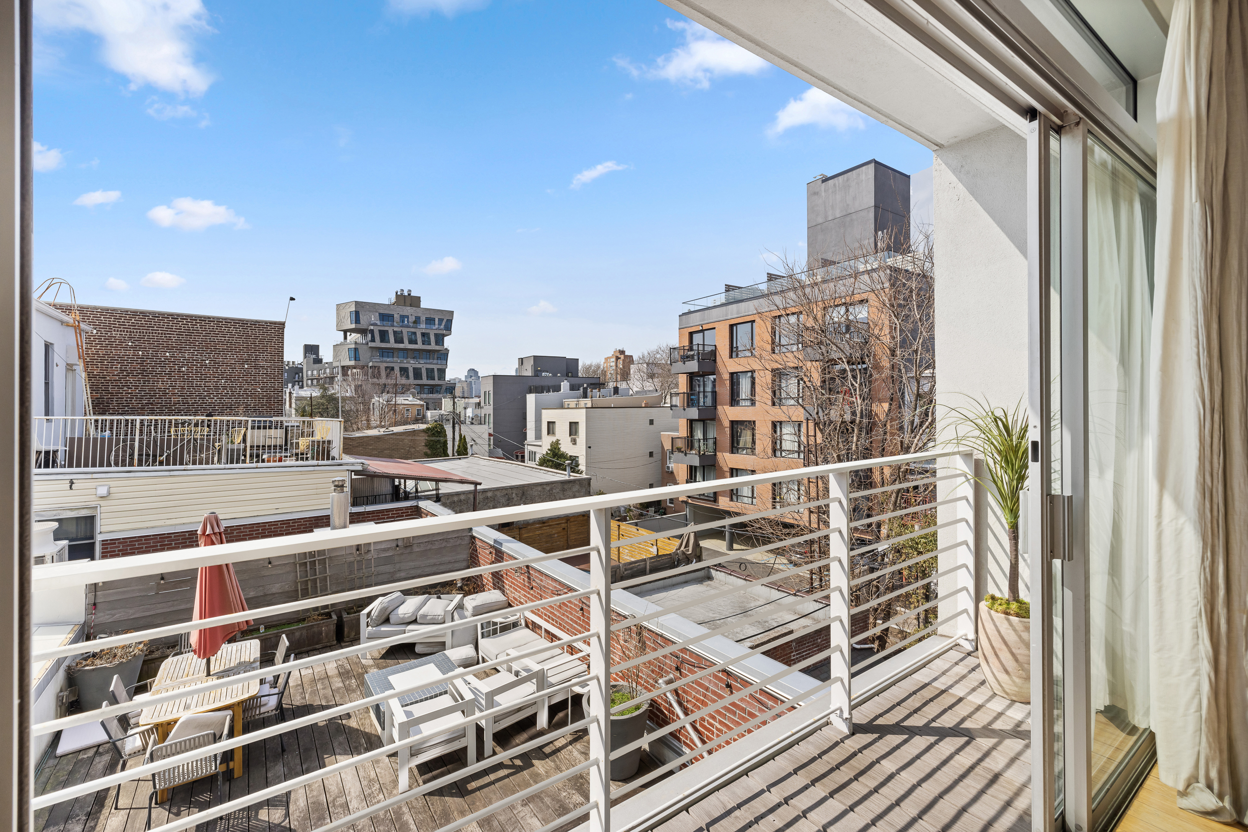 361 Manhattan Avenue, Unit 3AB Brooklyn, NY 11211 - Photo 2 of 21 a city view with tall buildings