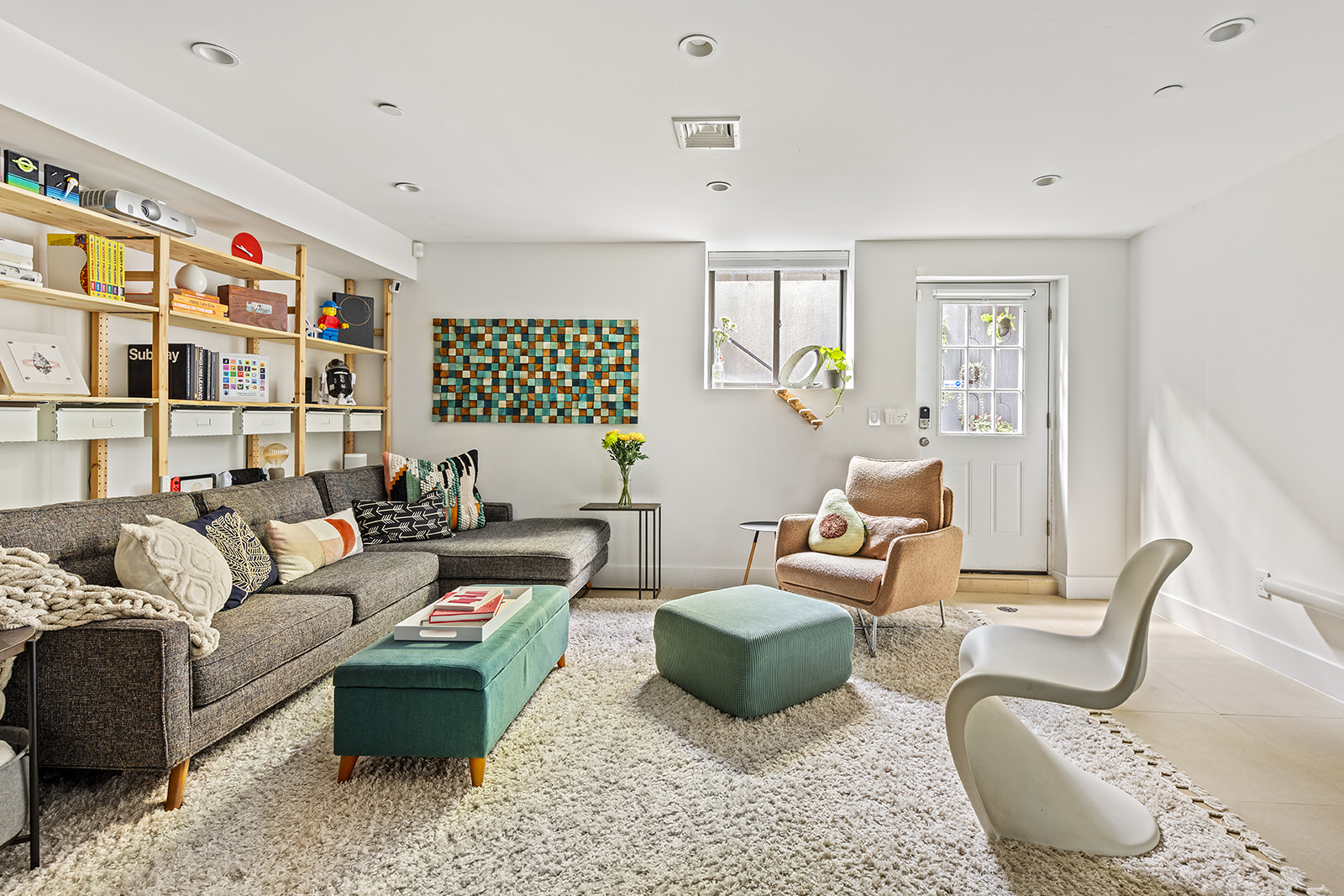495 Rutland Road, Unit 1 Brooklyn, NY 11203 - Photo 9 of 13 a living room with furniture or couch and a bookshelf