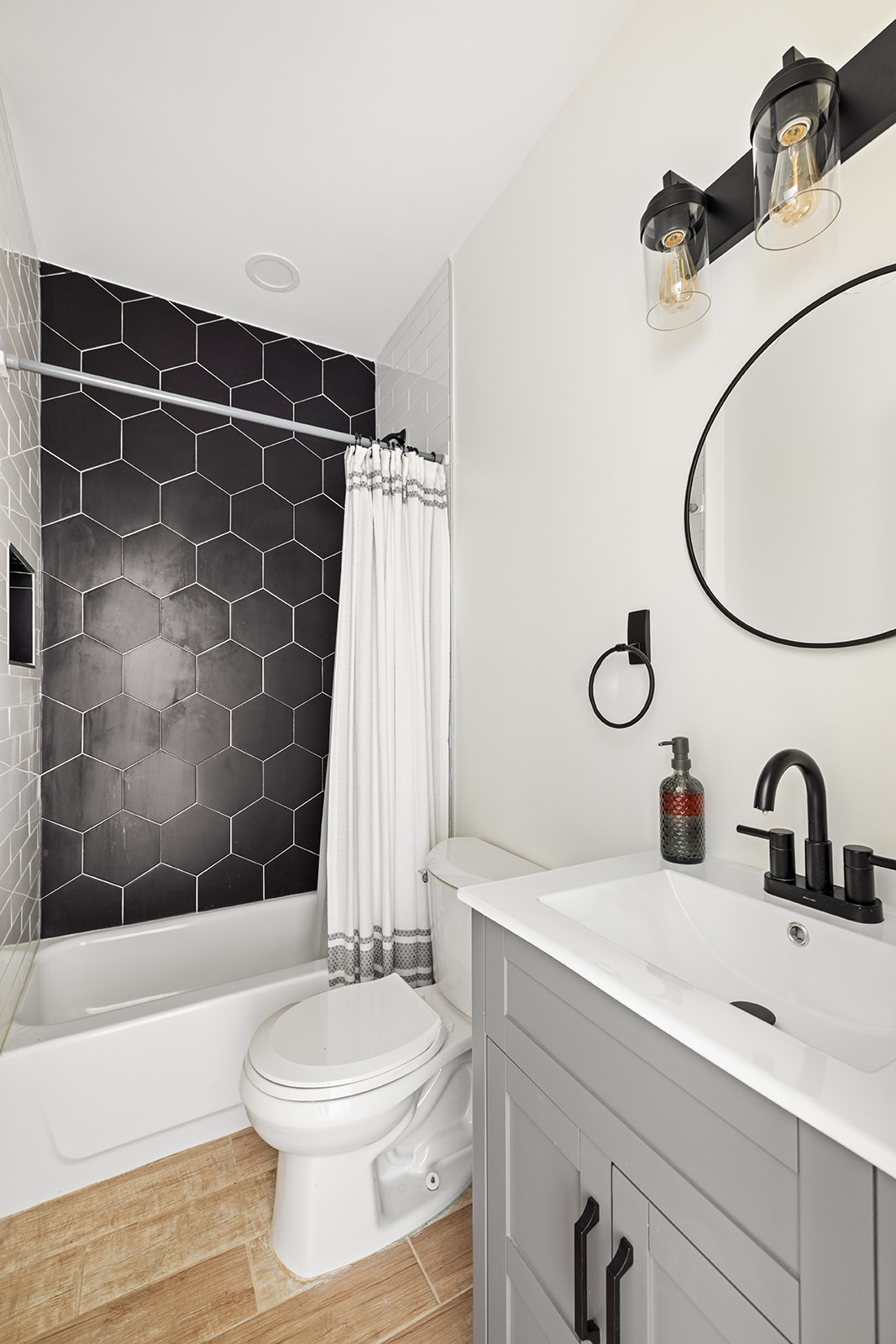 466 81st Street Brooklyn, NY 11209 - Photo 10 of 15 a bathroom with a sink toilet and shower