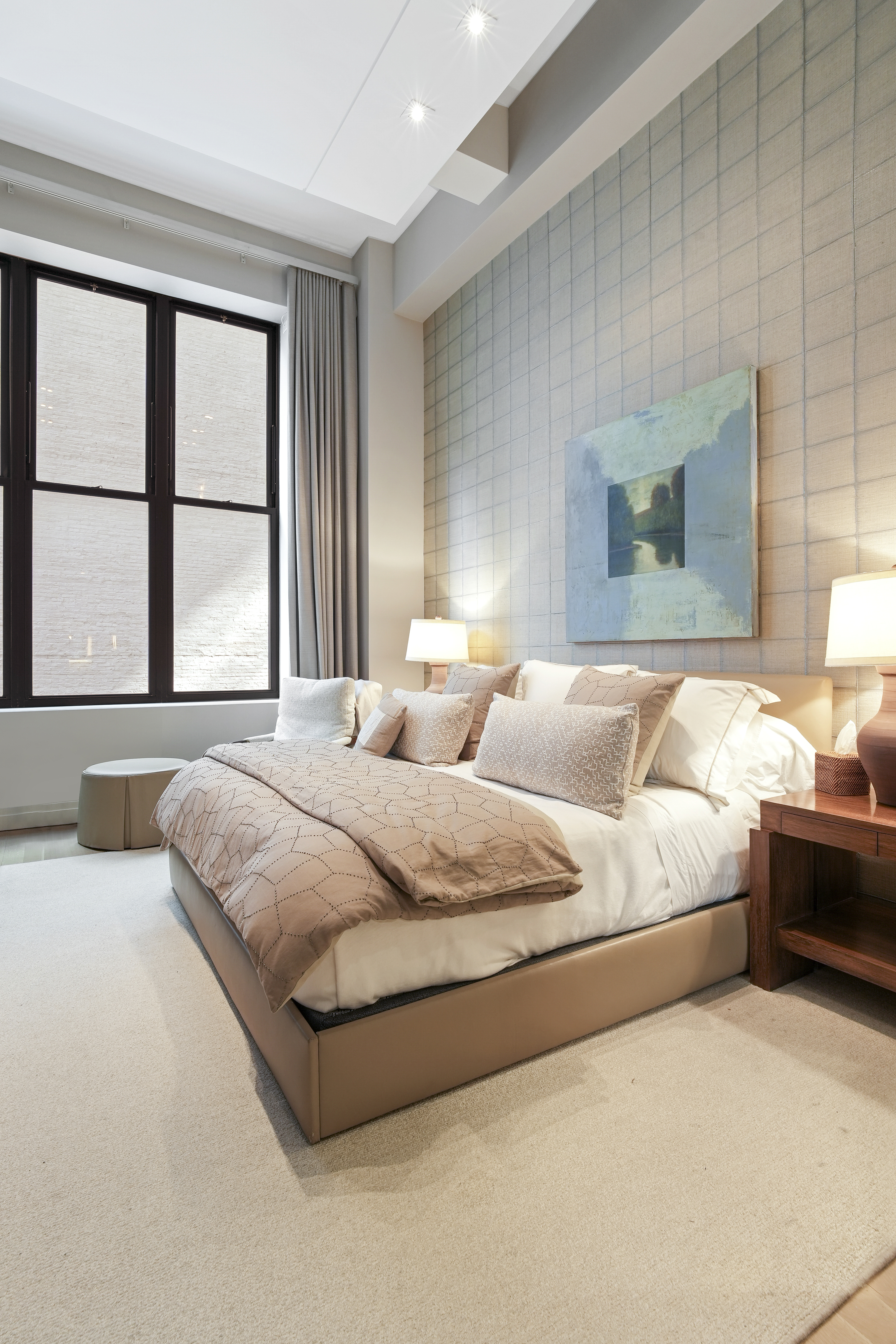 421 Hudson Street, Unit 221 Manhattan, NY 10014 - Photo 11 of 21 a bedroom with bed and a large window