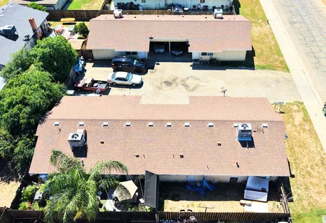 an aerial view of a house with a swimming pool