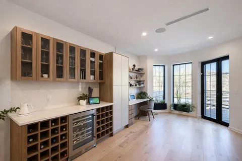 a view of workspace with wooden floor and furniture