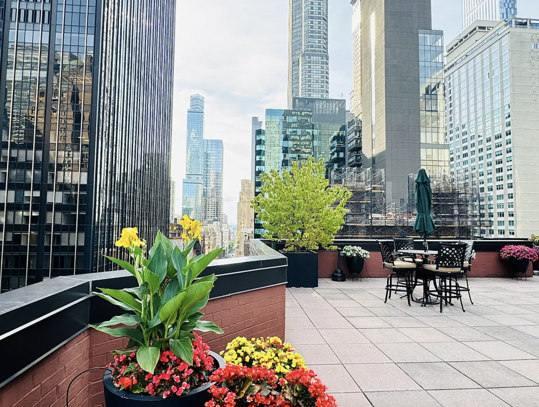 77 West 55th Street, Unit 11G Manhattan, NY 10019 - Photo 10 of 12 a view of balcony with furniture and a potted plant