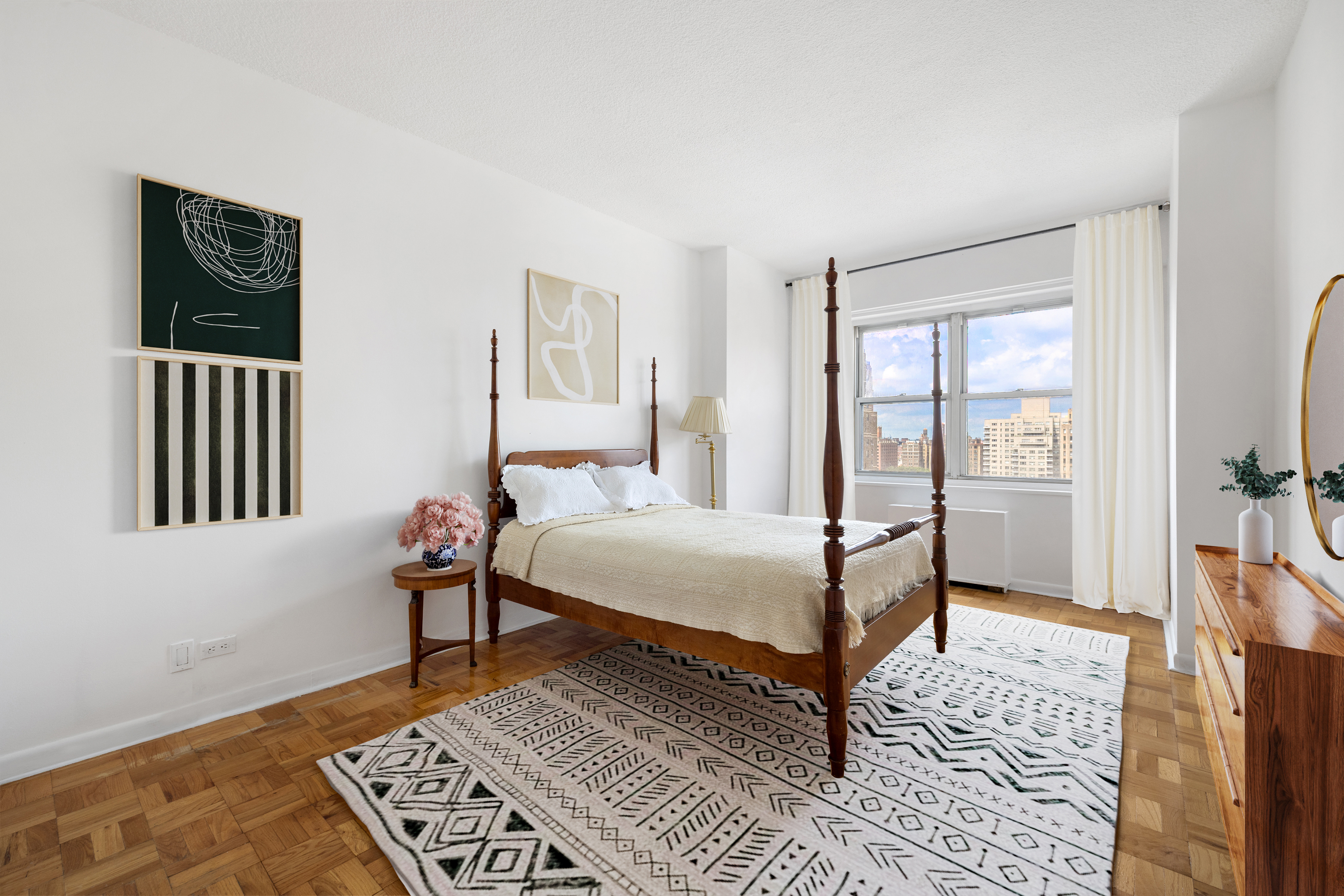 60 East 8th Street, Unit 15D Manhattan, NY 10003 - Photo 7 of 14 a bedroom with a bed table and a window