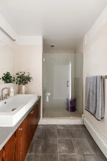 a bathroom with a tub sink and mirror