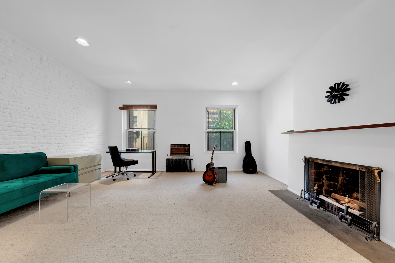 206 East 30th Street Manhattan, NY 10016 - Photo 13 of 17 a living room with furniture and a fireplace