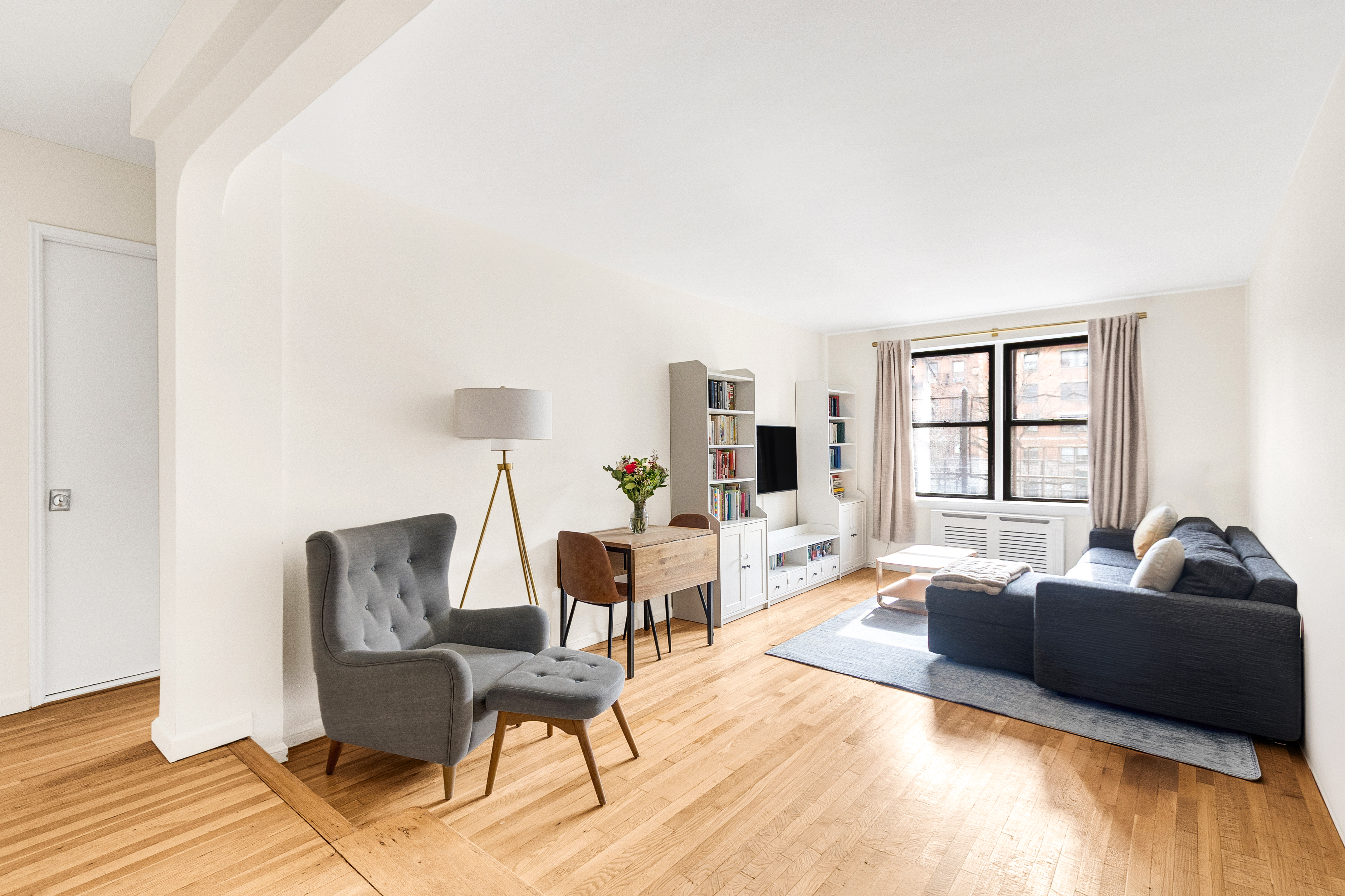 160 West 85th Street, Unit 2J1 Manhattan, NY 10024 - Photo 2 of 12 a living room with furniture and a window