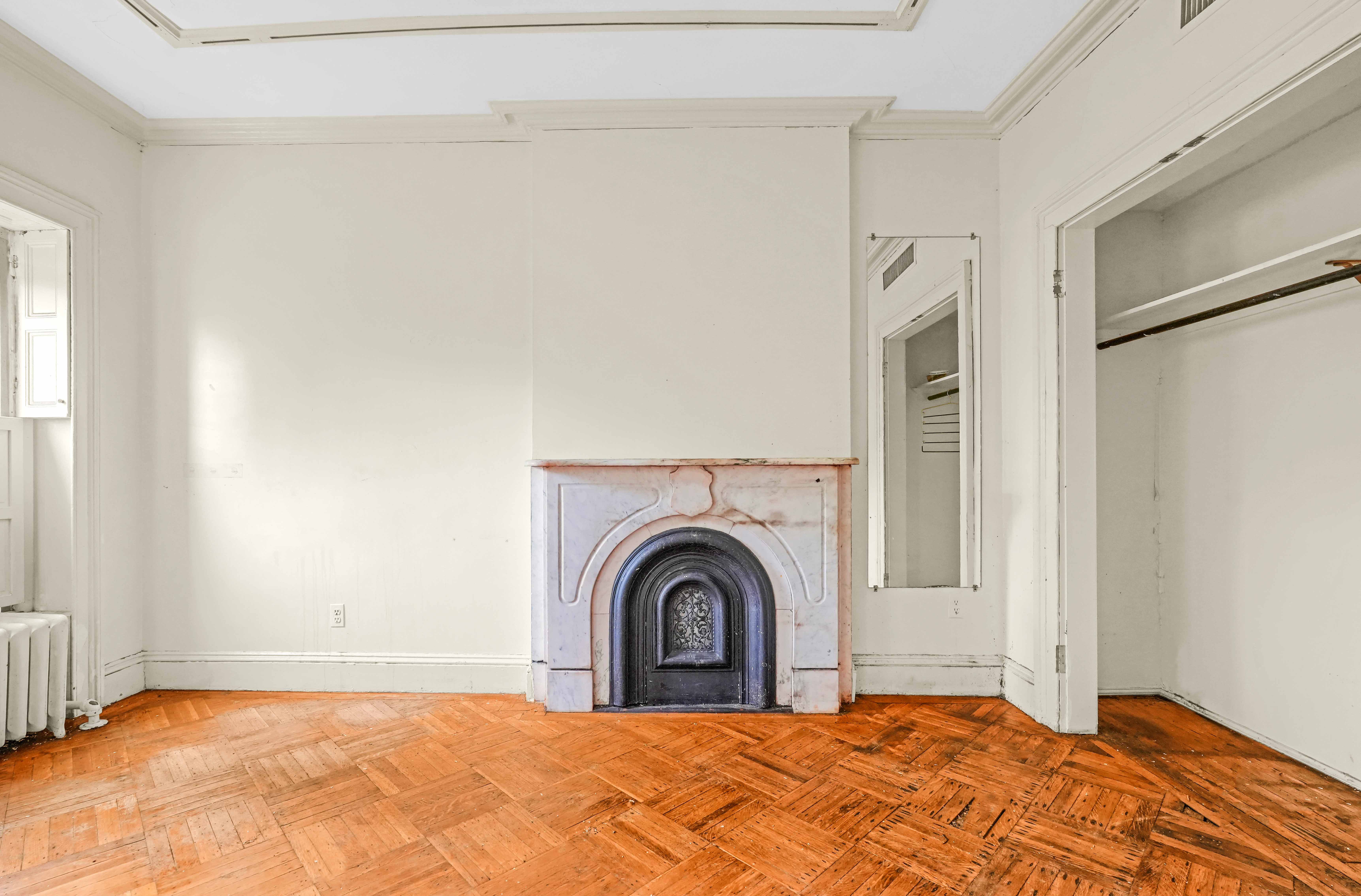 300 Lafayette Avenue Brooklyn, NY 11238 - Photo 13 of 17 a view of a bedroom with a bed and a window