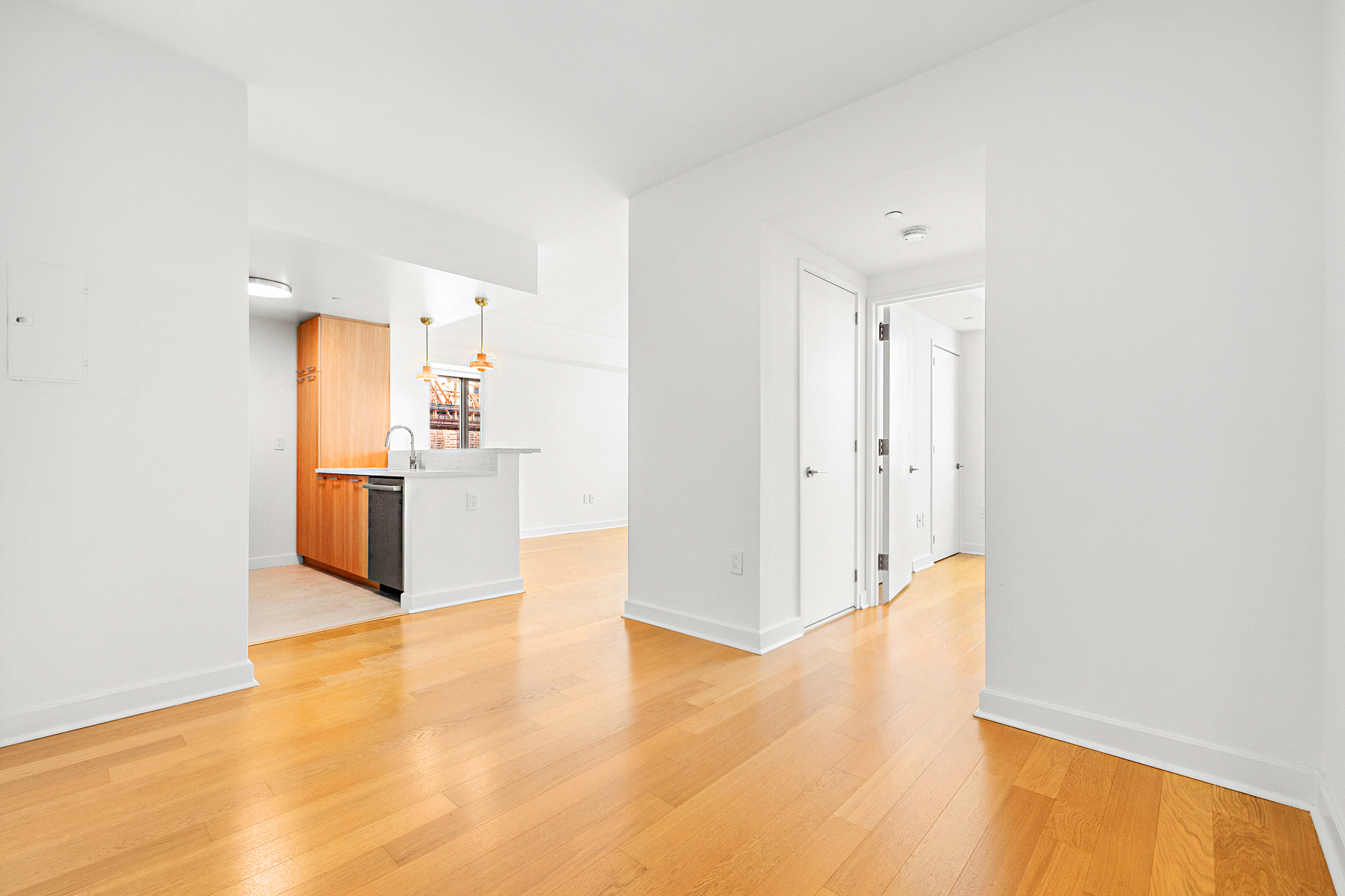 425 Main Street, Unit 9F Manhattan, NY 10044 - Photo 8 of 15 a view of a kitchen with a refrigerator and a stove top oven