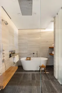 a bath room with a table and chairs
