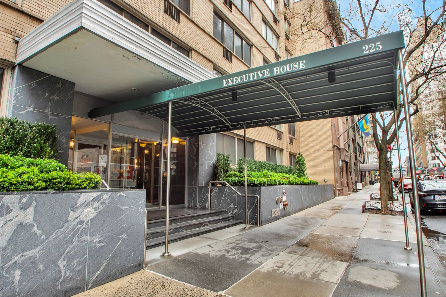 225 East 46th Street, Unit 12G Manhattan, NY 10017 - Photo 17 of 19 a view of a patio with table and chairs under an umbrella