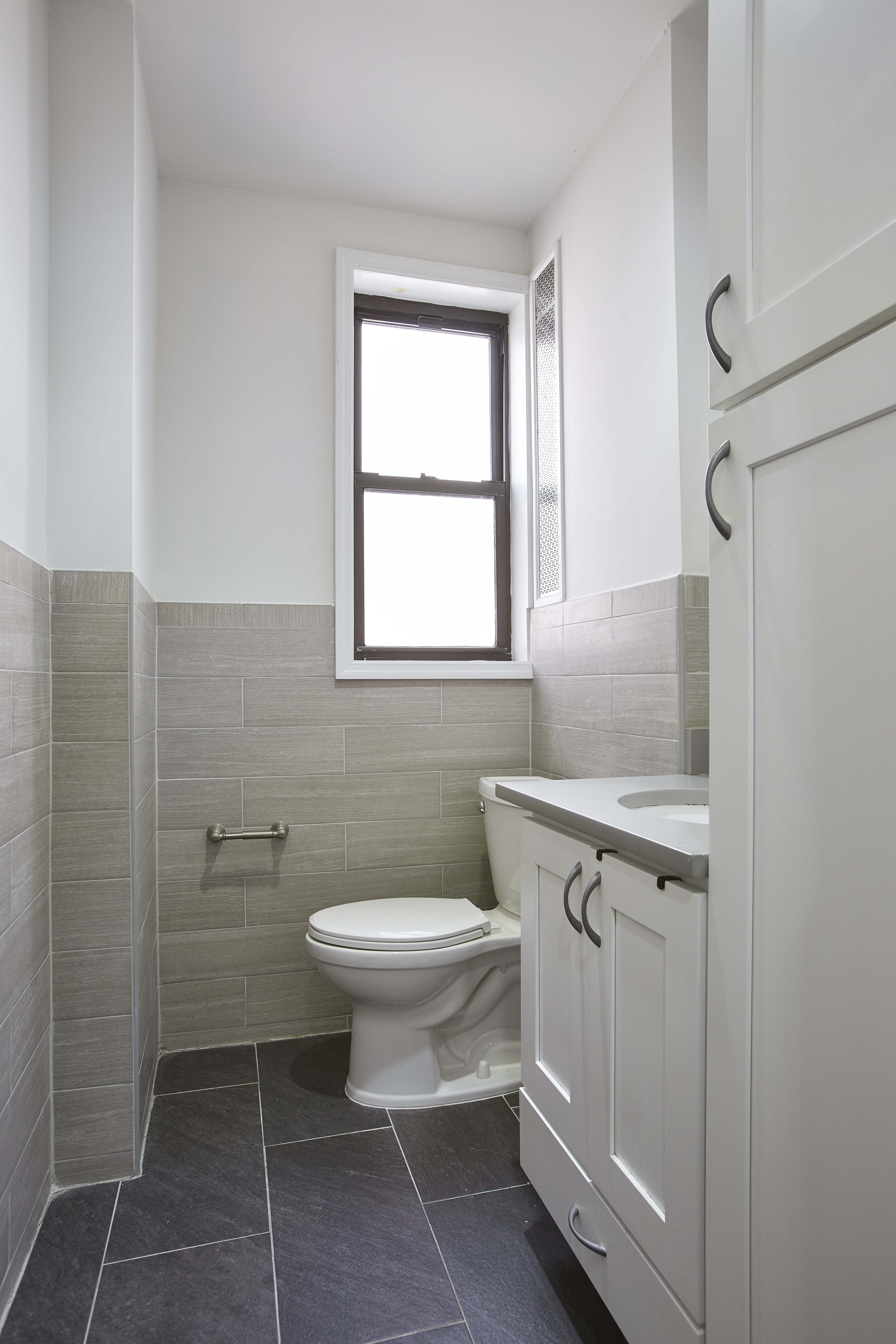 567 6th Street, Unit 7 Brooklyn, NY 11215 - Photo 5 of 9 a bathroom with a sink toilet and shower