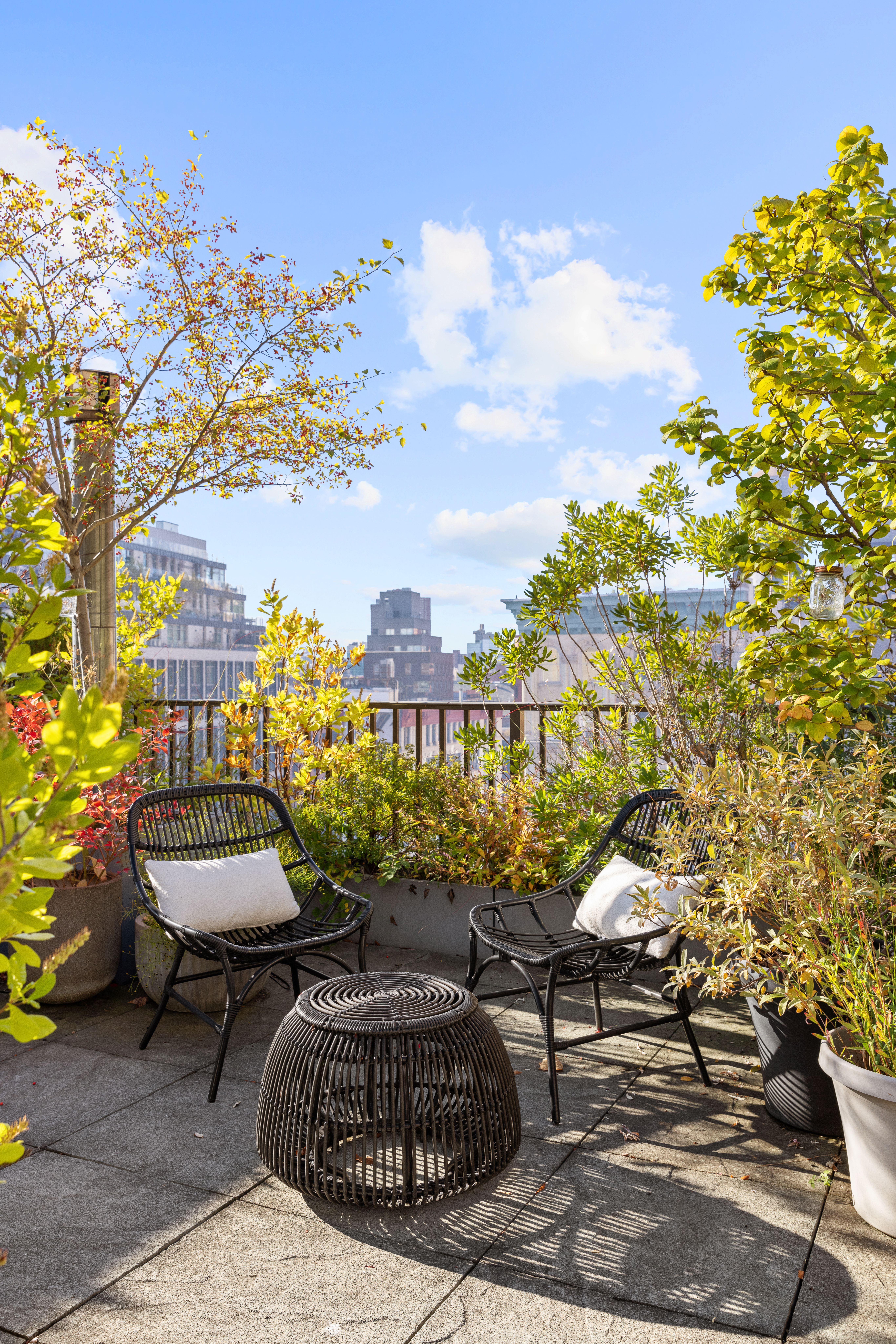 7 Bond Street, Unit PHAB Manhattan, NY 10012 - Photo 19 of 20 a view of a chairs and table in a backyard