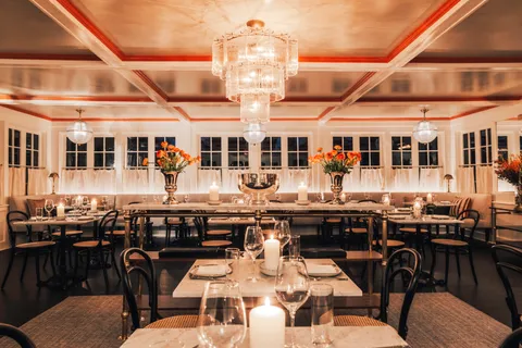 a dinning area with lots of tables and chairs