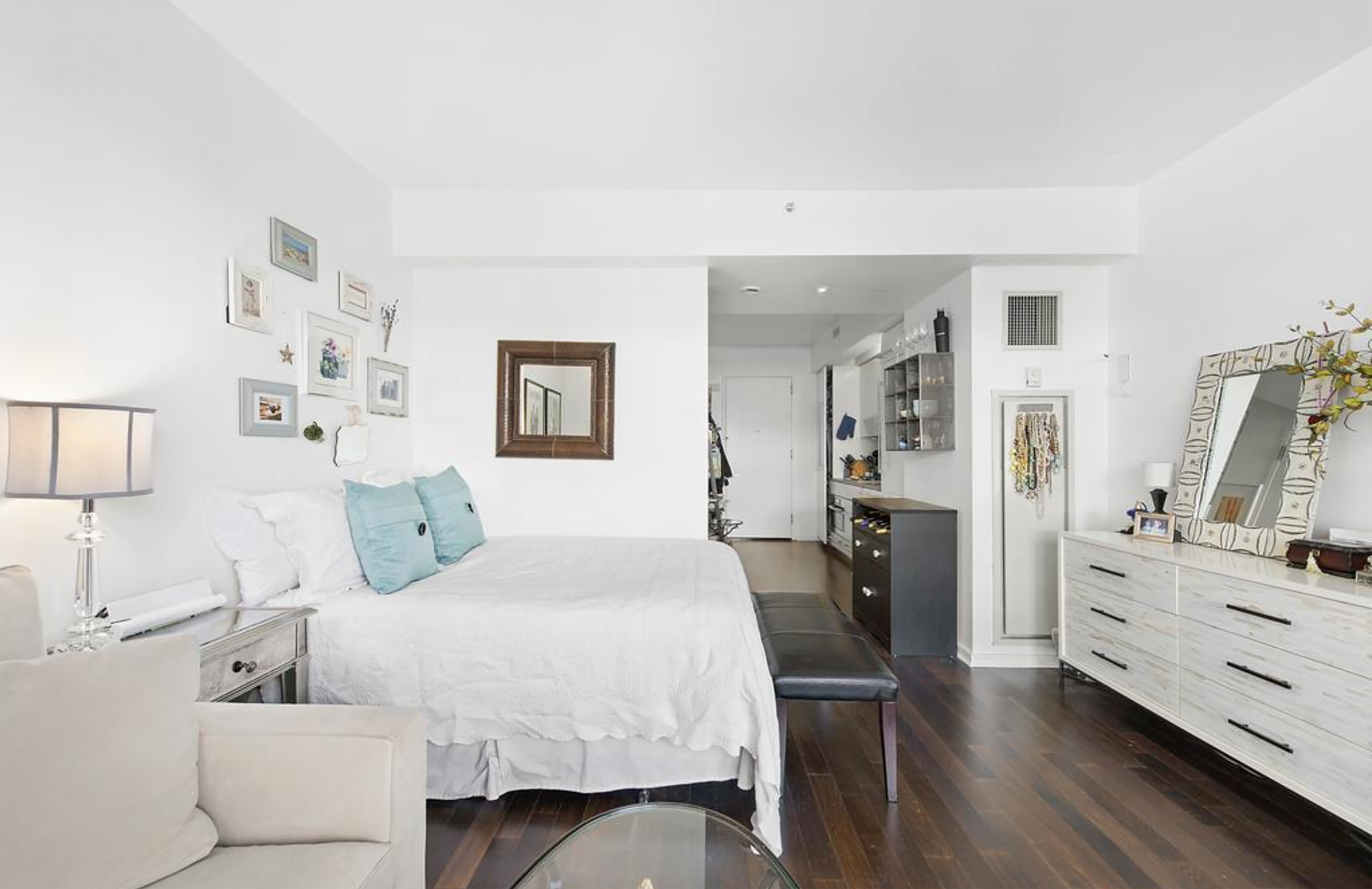 340 East 23rd Street, Unit 9J Manhattan, NY 10010 - Photo 2 of 5 a bedroom with a bed and furniture