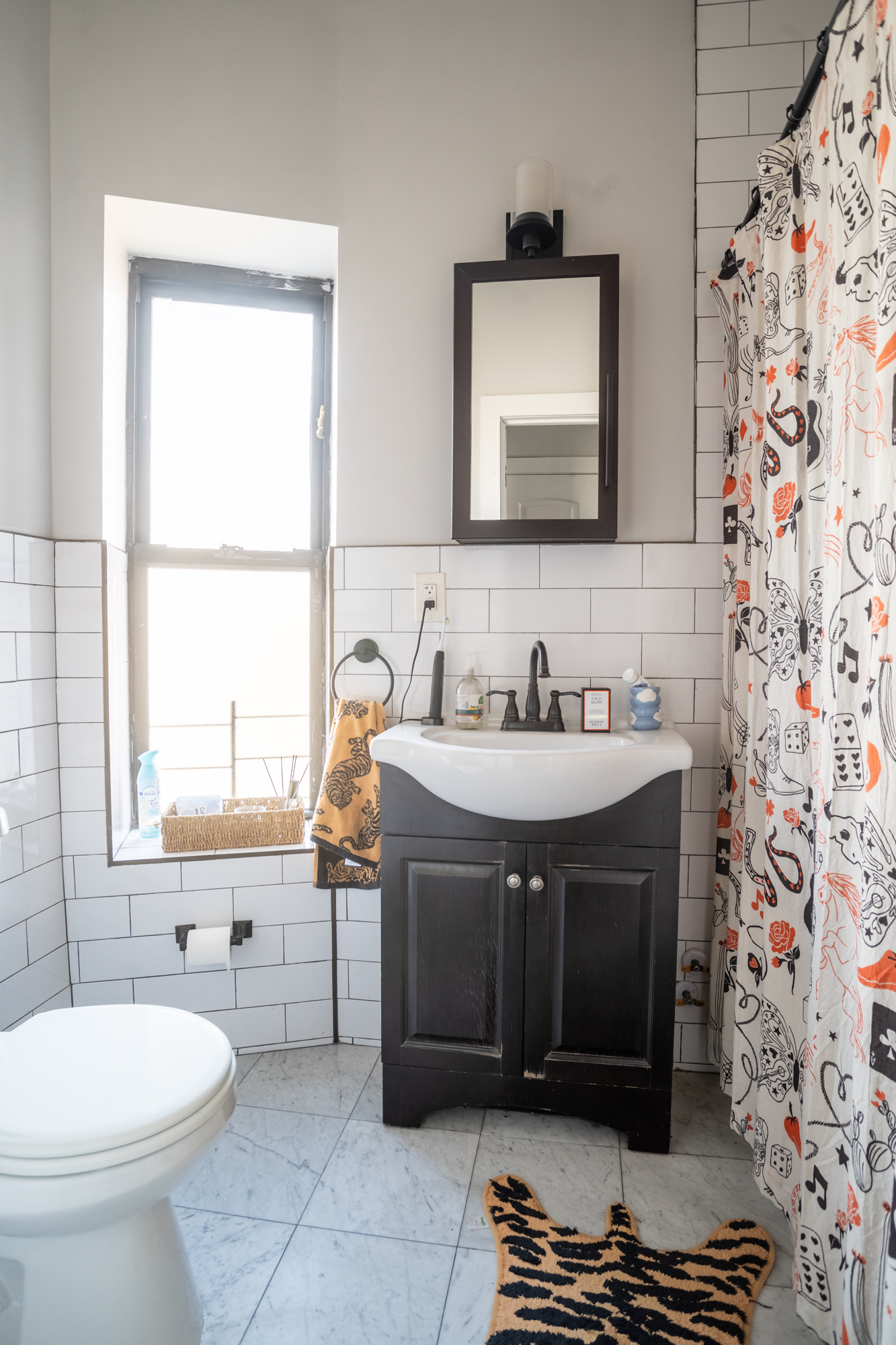 944 Marcy Avenue, Unit 3D Brooklyn, NY 11216 - Photo 7 of 9 a bathroom with a sink and a mirror