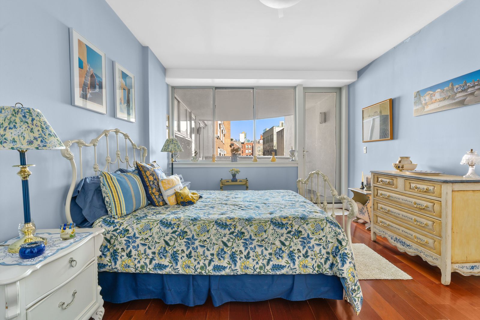 123 Baxter Street, Unit 6B Manhattan, NY 10013 - Photo 12 of 18 a bedroom with a bed and wooden floor