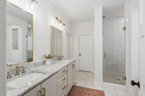 a bathroom with a bathtub and a shower