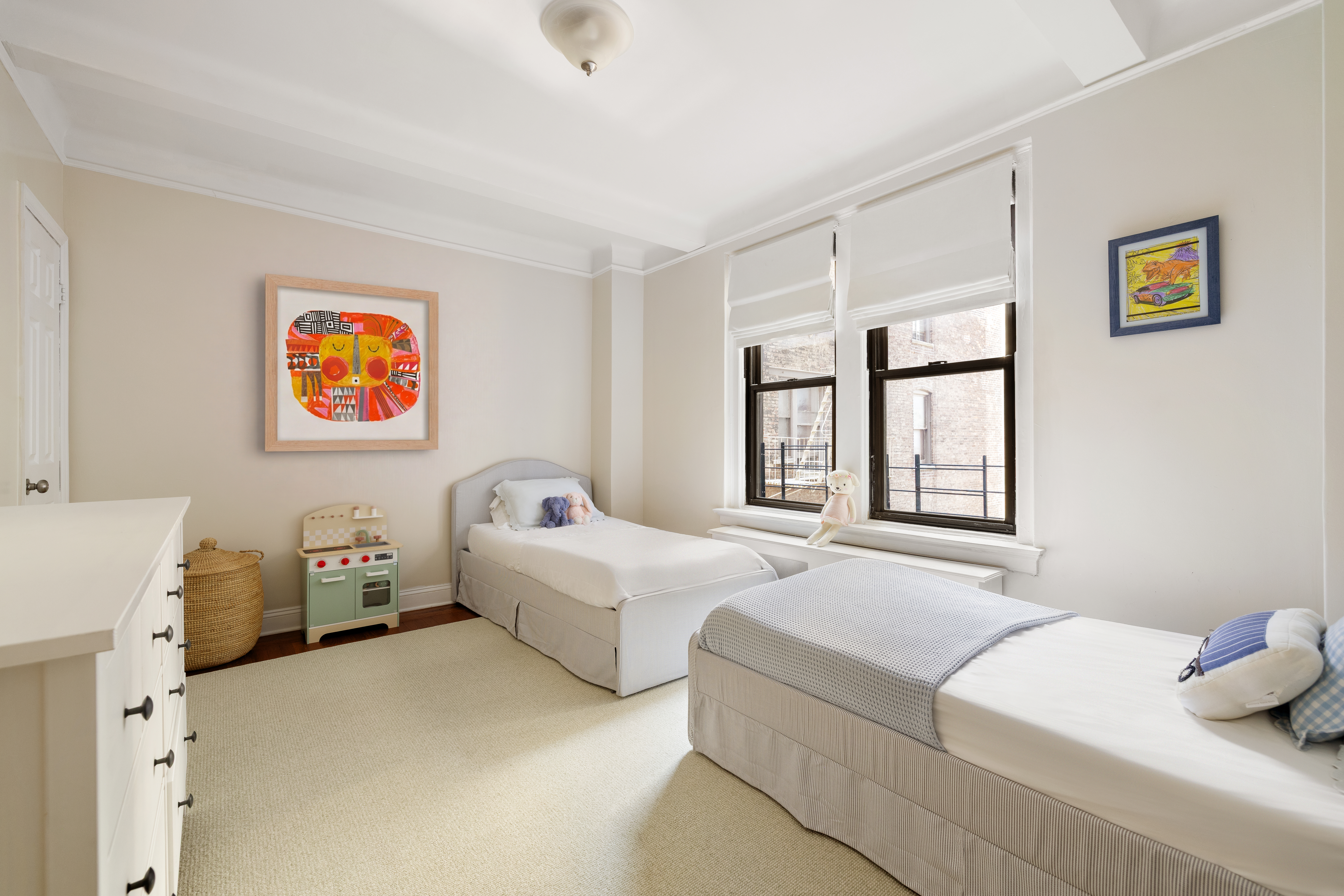 60 East 96th Street, Unit 6C Manhattan, NY 10128 - Photo 6 of 9 a bedroom with a bed and a large window