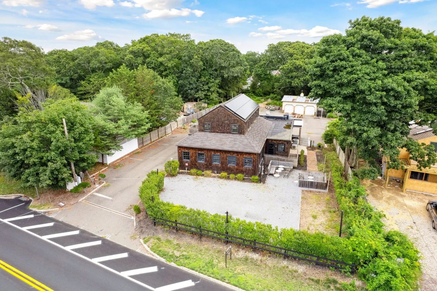 an aerial view of a house with yard and green space