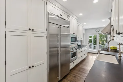 a kitchen with stainless steel appliances a refrigerator and a sink