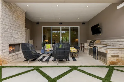 a kitchen with a sink and a stove top oven