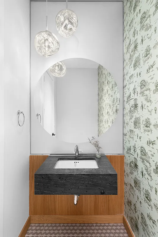 181 18th Street, Unit 1002 Brooklyn, NY 11215 - Photo 6 of 19 a bathroom with a sink and a mirror