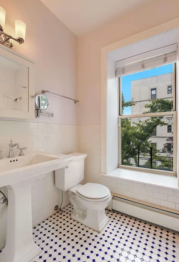 a bathroom with a sink a toilet and a shower