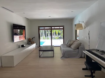 a living room with furniture and a window