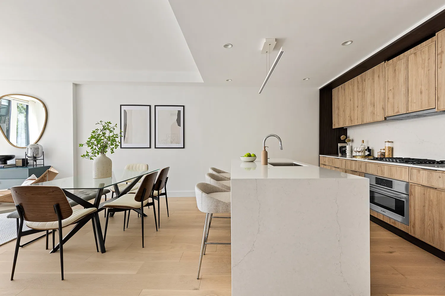 a kitchen with a table chairs and a refrigerator
