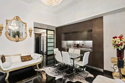 a work room with furniture and wooden floor