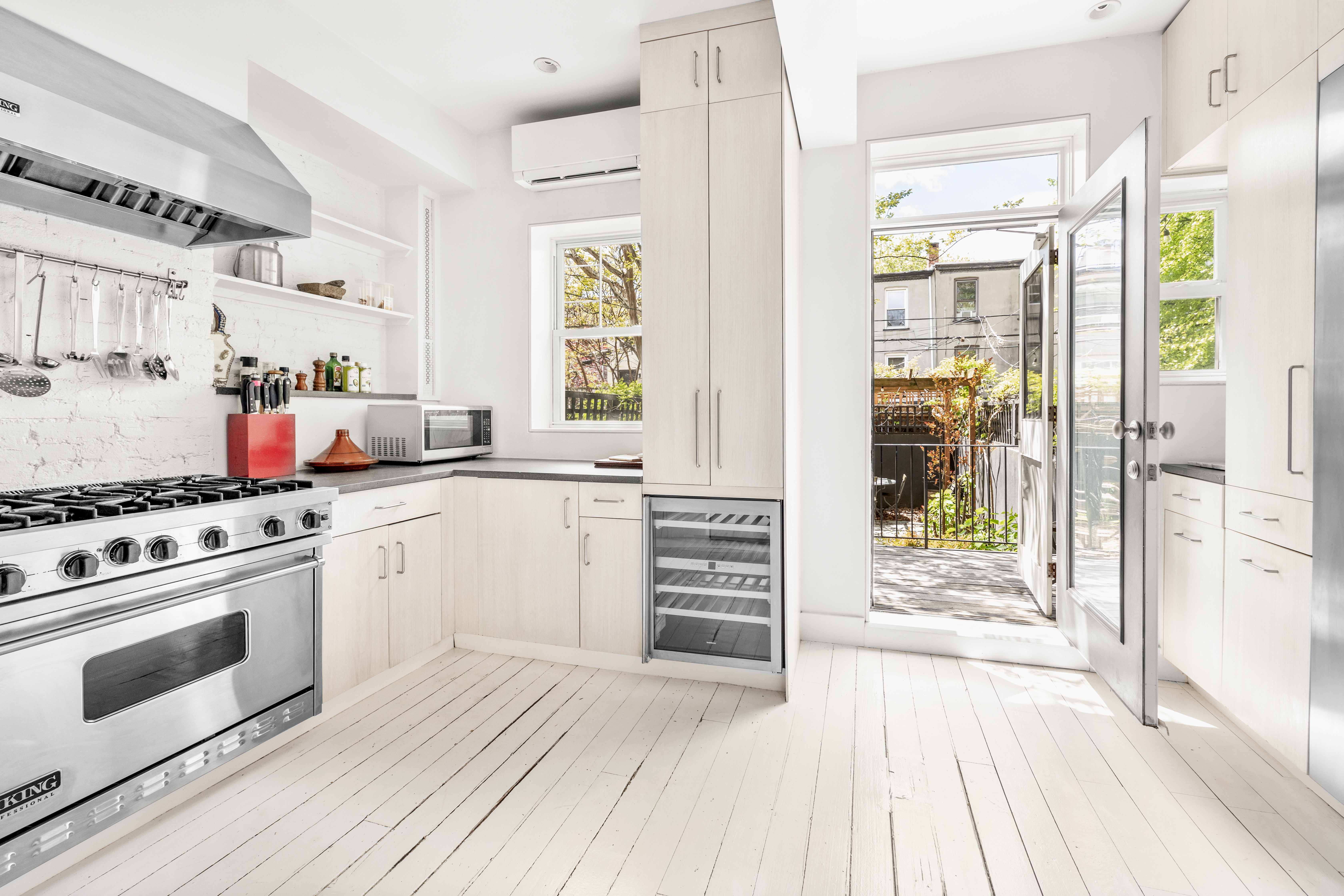 26 A 1st Street Brooklyn, NY 11231 - Photo 7 of 20 a kitchen with stainless steel appliances a stove and white cabinets
