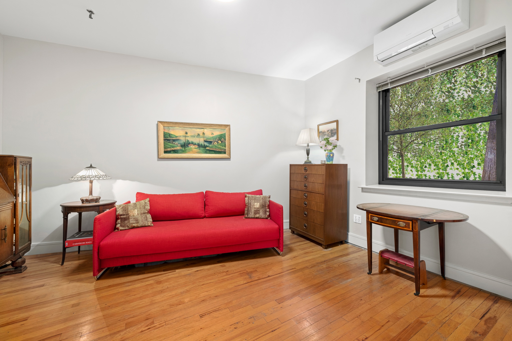 166 Bank Street, Unit LOFT2C Manhattan, NY 10014 - Photo 8 of 11 a living room with furniture and a window