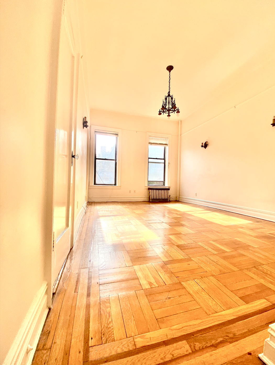 121 7th Avenue, Unit 3R Brooklyn, NY 11215 - Photo 3 of 7 a view of a room with wooden floor and windows