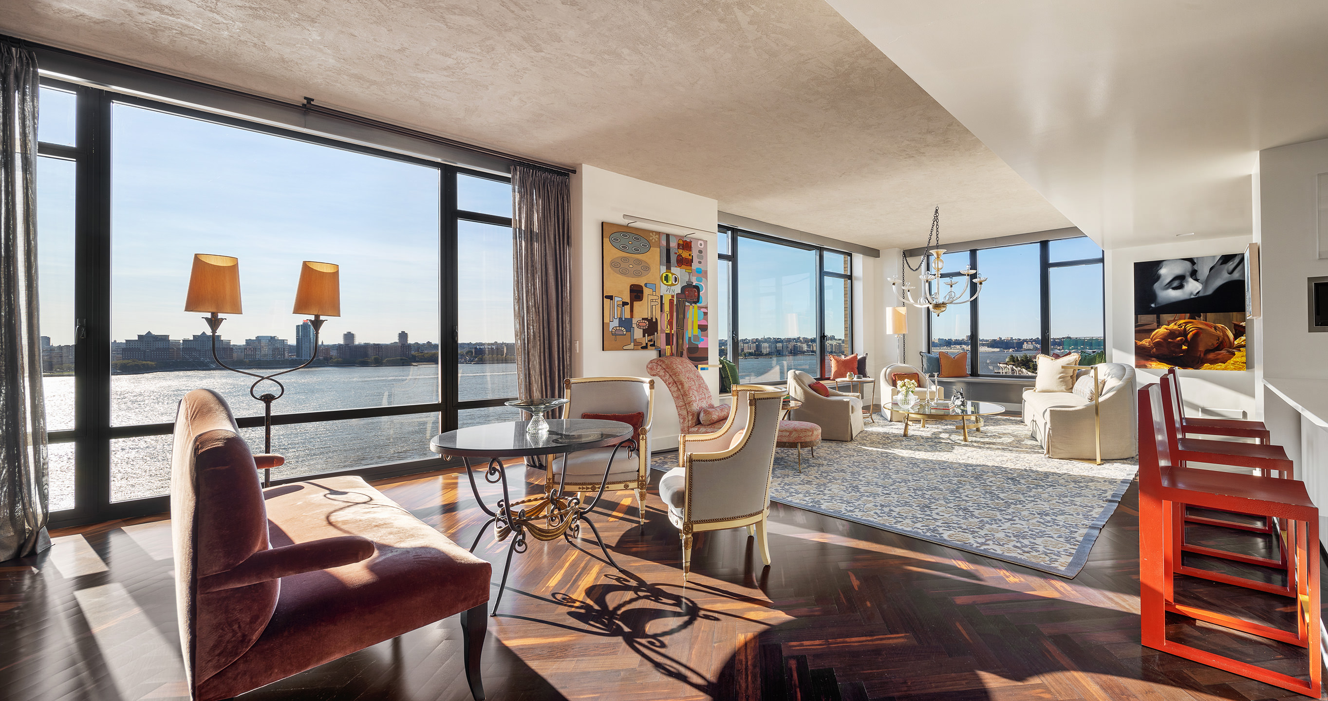 400 West 12th Street, Unit 12C Manhattan, NY 10014 - Photo 1 of 24 a living room with furniture and a table