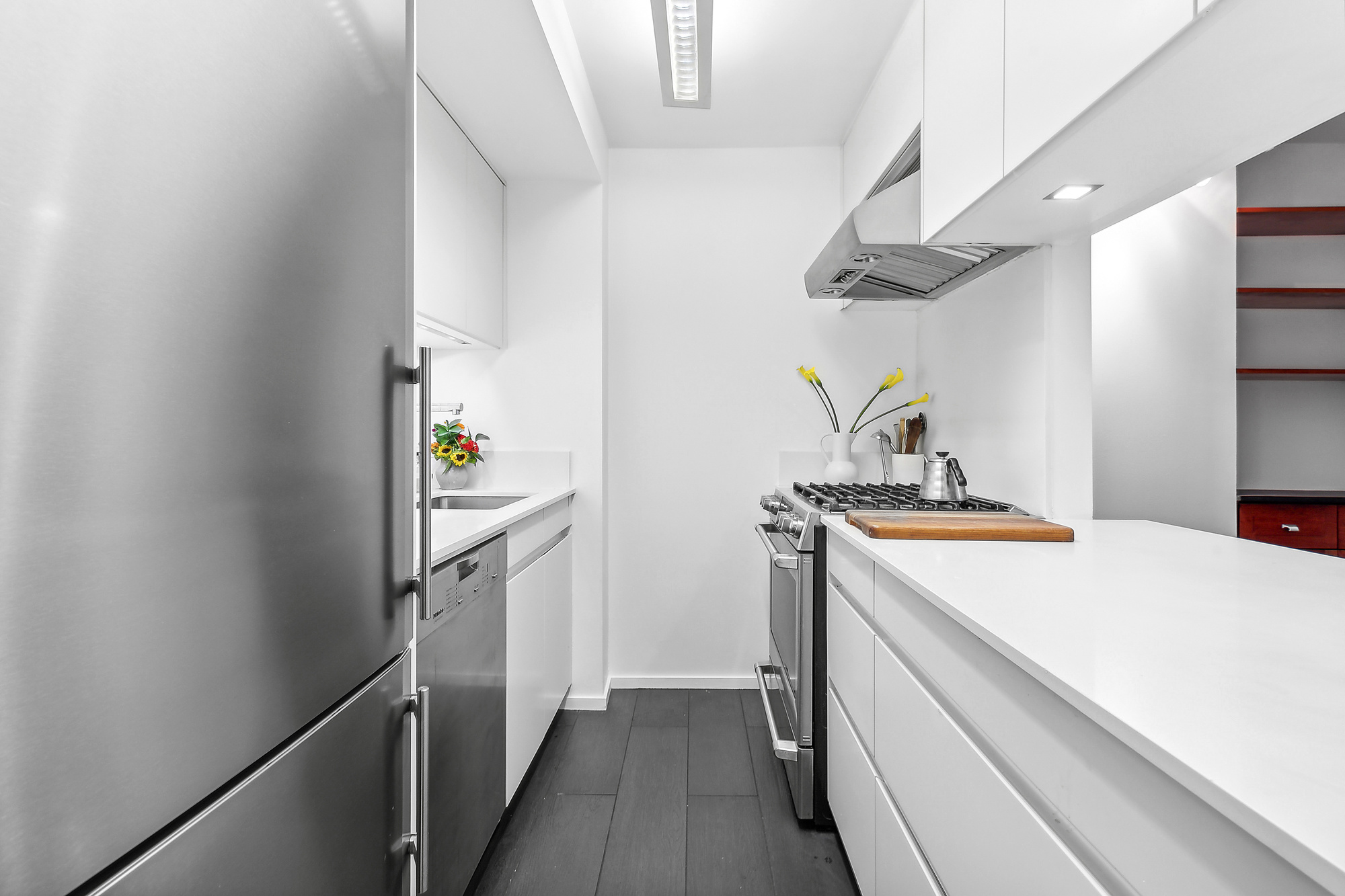 303 Greenwich Street, Unit 7F Manhattan, NY 10013 - Photo 4 of 7 a kitchen with a refrigerator and a stove