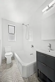 a bathroom with a sink toilet and a bathtub