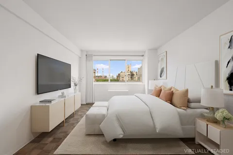 a bedroom with bed and a flat screen tv