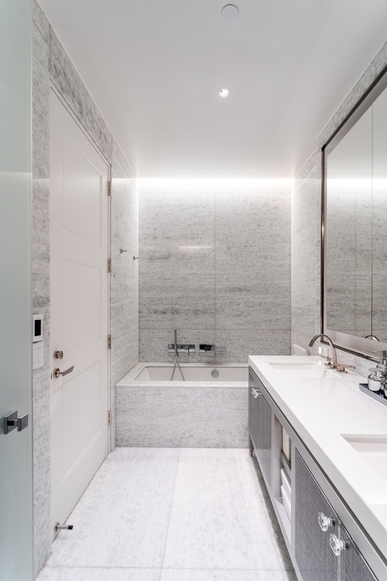 35 Hudson Yards, Unit 5903 Manhattan, NY 10001 - Photo 9 of 15 a bathroom with a tub a sink and mirror