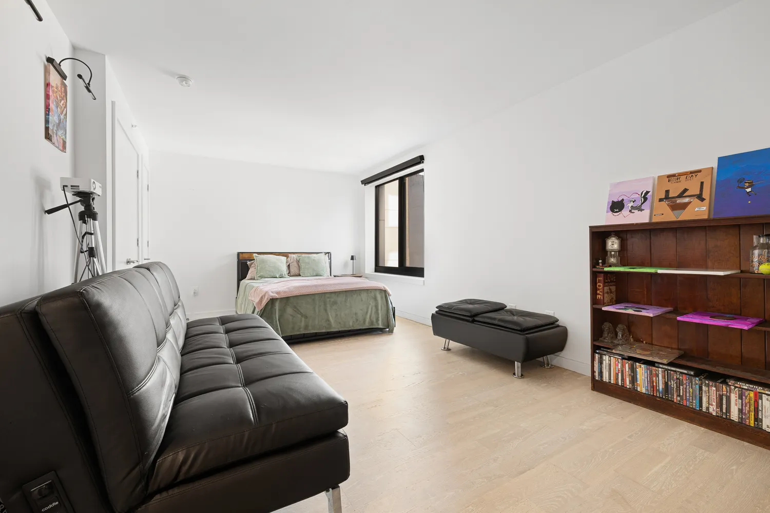 a bedroom with furniture and a window