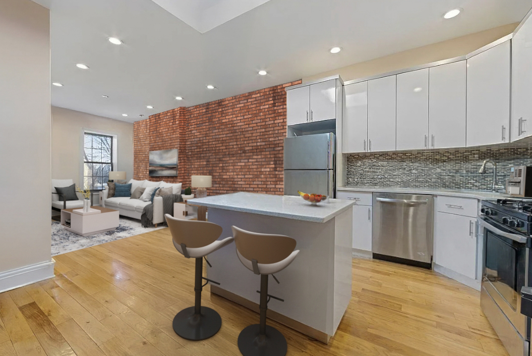 426 Rogers Avenue Brooklyn, NY 11225 - Photo 5 of 9 a kitchen with kitchen island granite countertop a sink and a stove