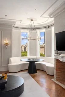 a spacious bathroom with a tub sink and mirror