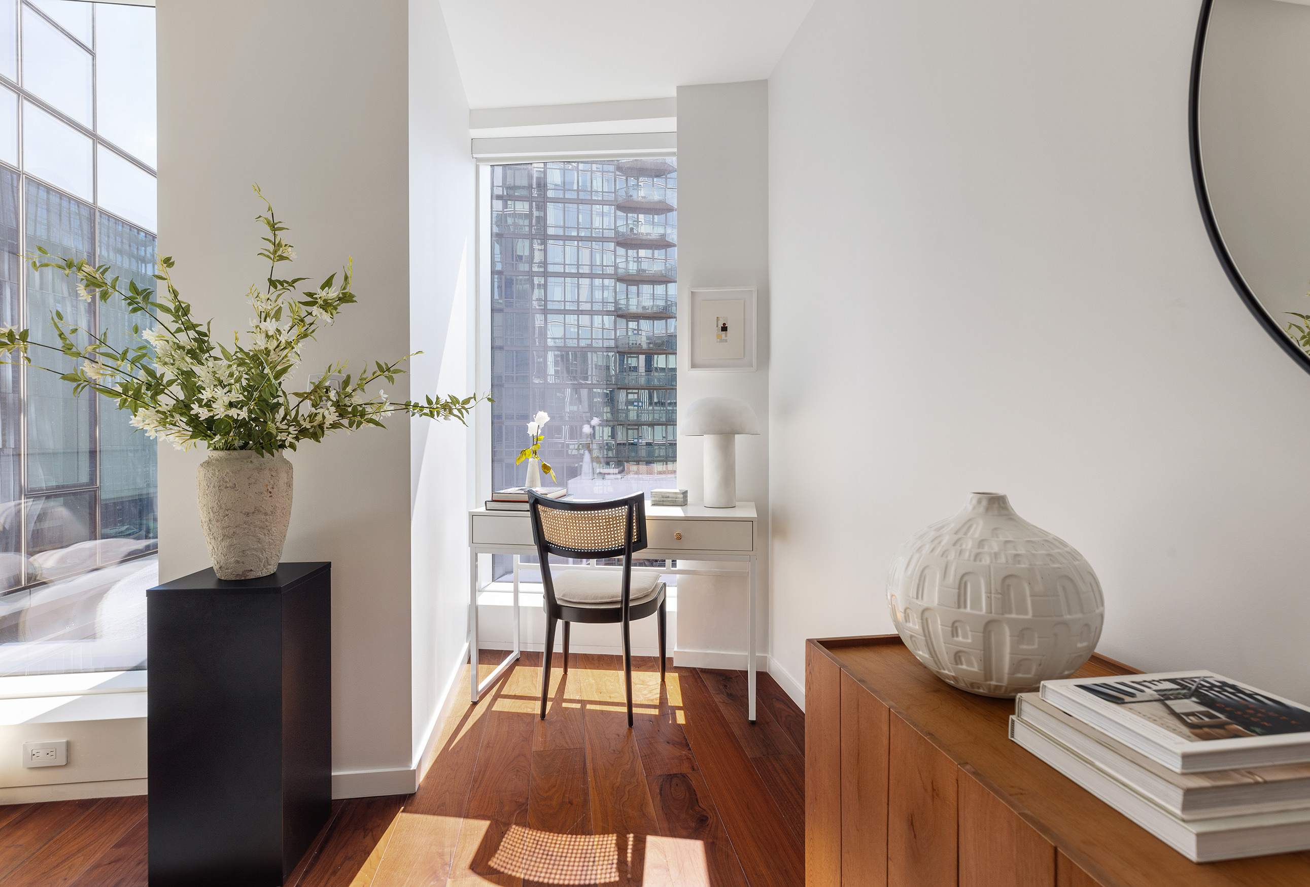 1 West End Avenue, Unit 15E Manhattan, NY 10023 - Photo 3 of 31 a living room with furniture and a potted plant