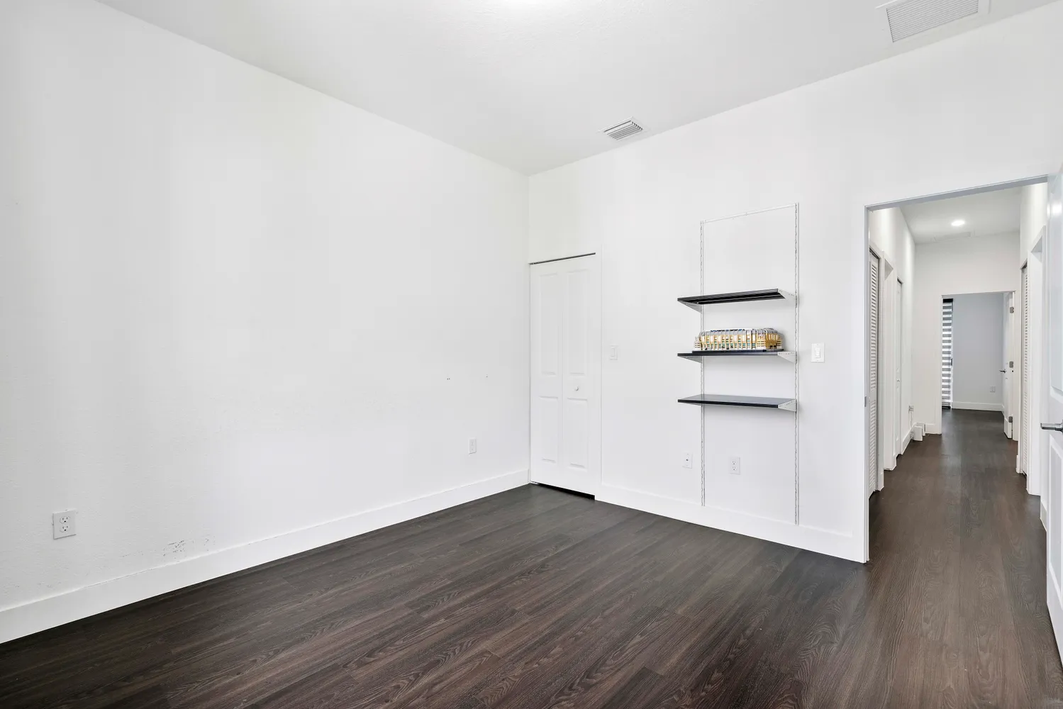 a view of a kitchen with wooden floor