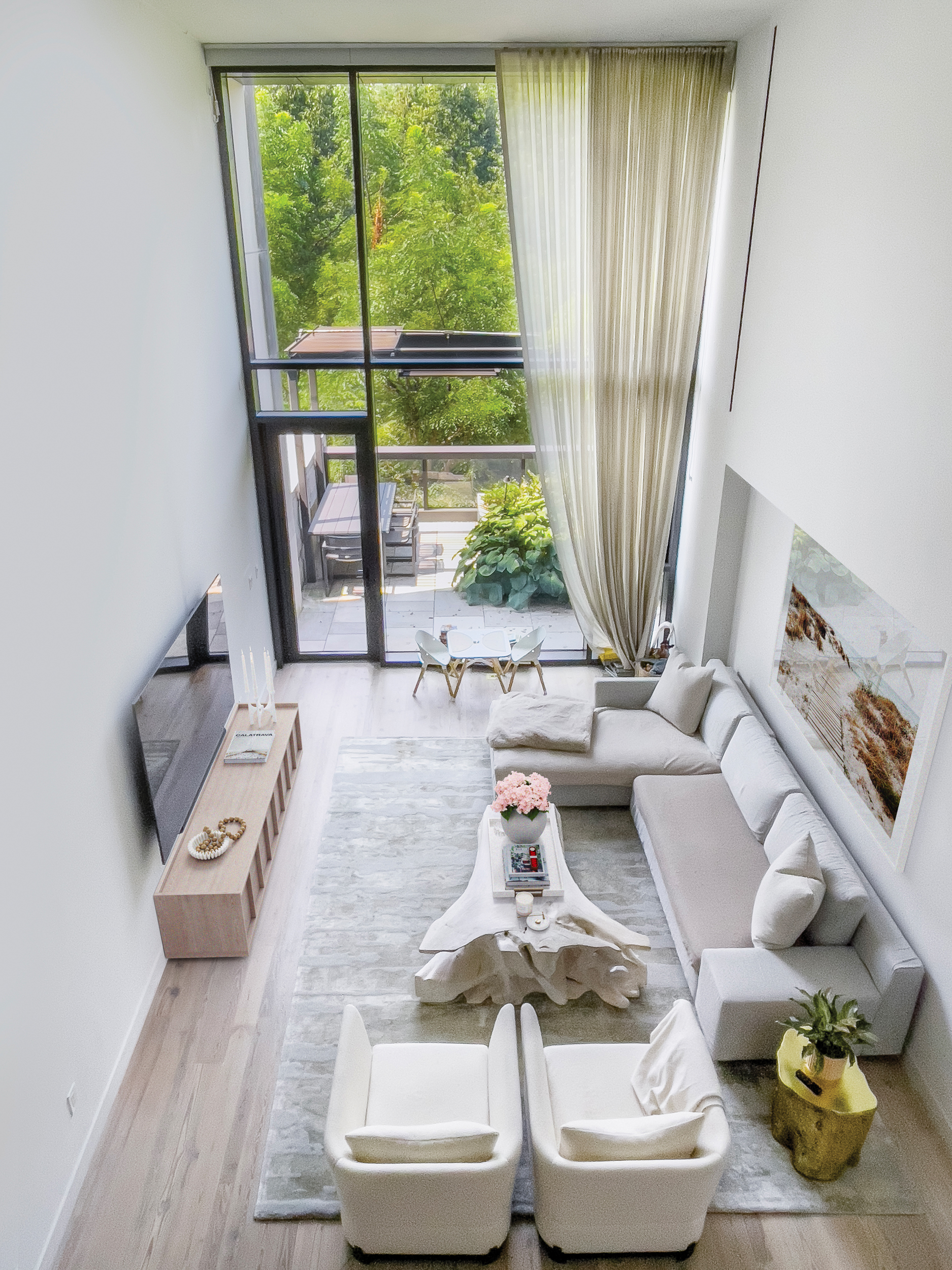 90 Furman Street, Unit N208 Brooklyn, NY 11201 - Photo 3 of 23 a living room with furniture and a window