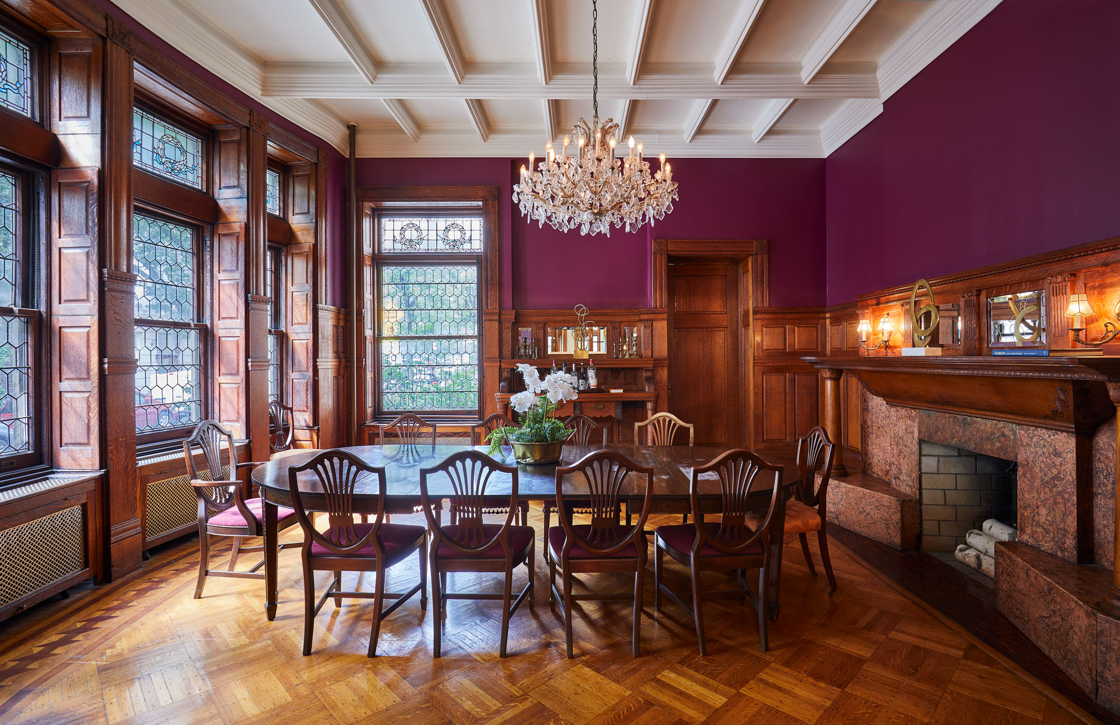 320 Convent Avenue Manhattan, NY 10031 - Photo 1 of 15 a view of a dining room with furniture window and wooden floor