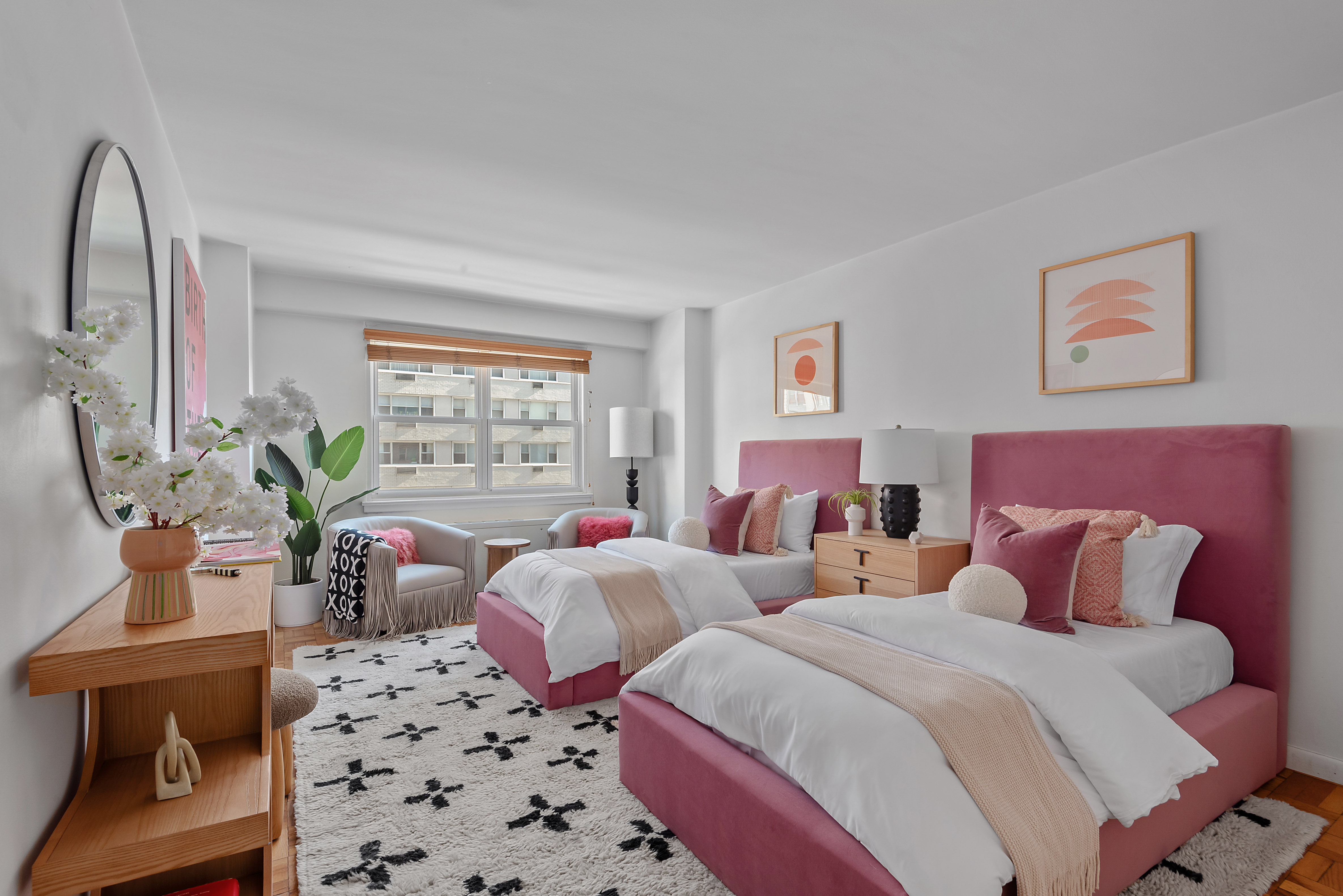 101 West 12th Street, Unit 6MN Manhattan, NY 10011 - Photo 6 of 17 a bedroom with two beds and a window