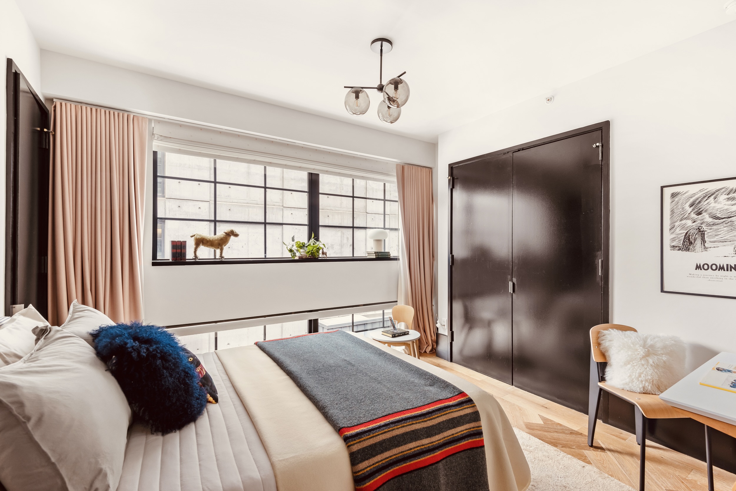 51 Jay Street, Unit 5J Brooklyn, NY 11201 - Photo 9 of 15 a bed sitting in a bedroom next to a window