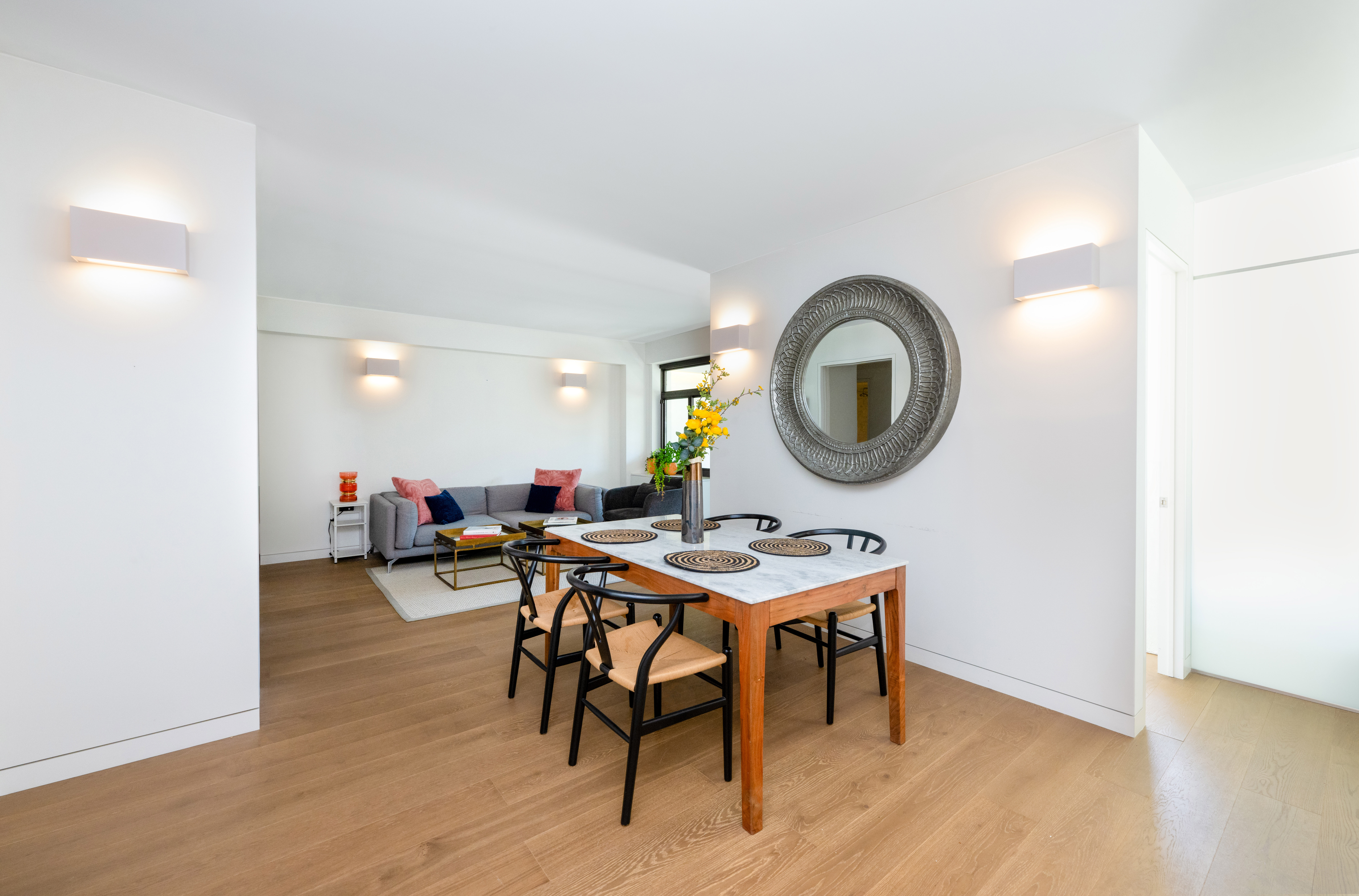 124 East 79th Street, Unit 7D Manhattan, NY 10075 - Photo 13 of 25 a view of a dining room with furniture and chandelier